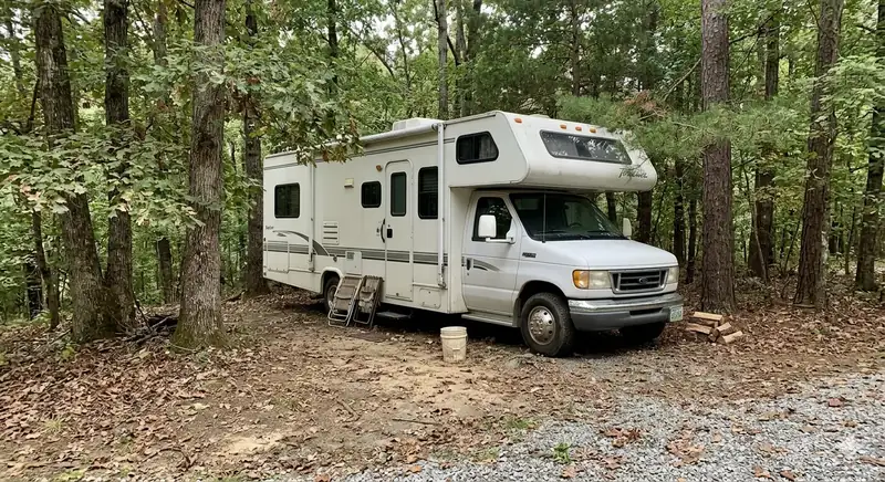 RV campsite service area near Nashville Tennessee with motorhome parked in wooded campground